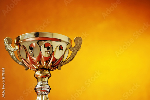 Trophy cup on orange background