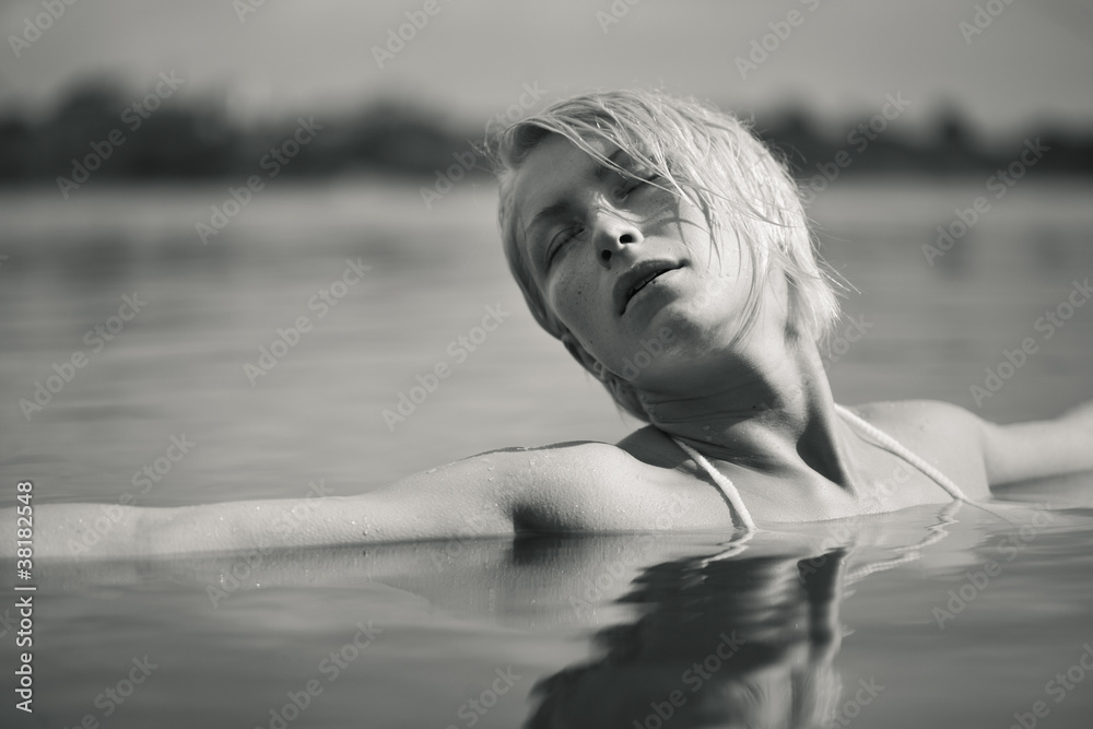Fototapeta premium Young attractive woman in the water