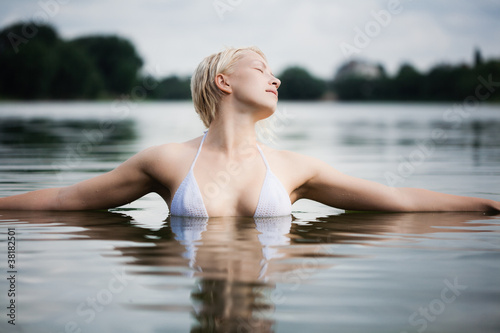 Young attractive woman in the water