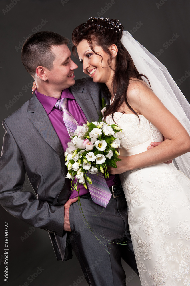 Groom and bride in a studio Groom and bride in a studio