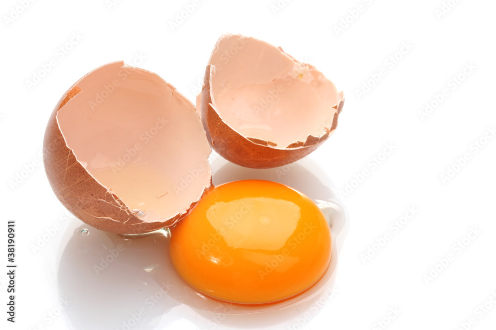 Brown egg with yolk isolated on white Brown egg with yolk isolated on white