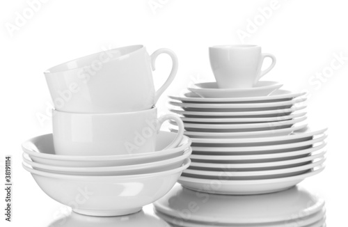 Clean plates and cups isolated on white