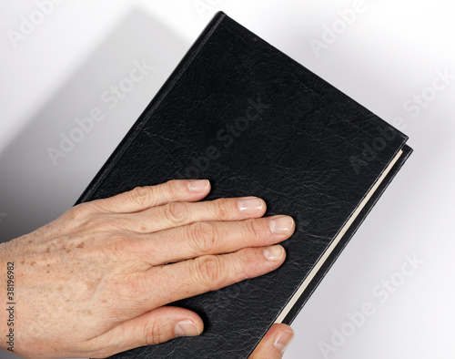Obraz na płótnie hand on the Holy Bible