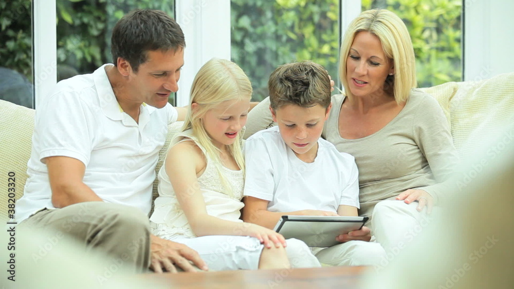 Young Caucasian Family Using Wireless Tablet Young Caucasian Family Using Wireless Tablet