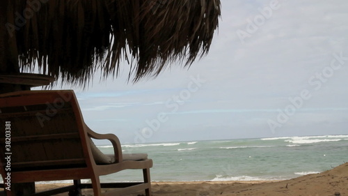 Chair blows in wind at beach
