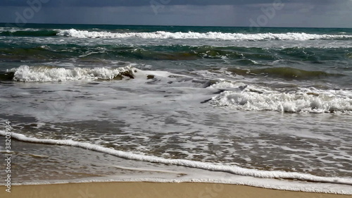 Heart being washed by waves