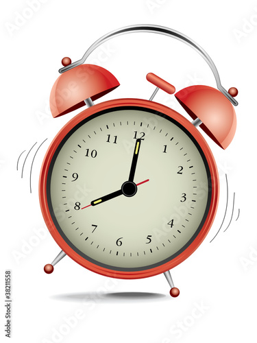 Classic red alarm clock over white background