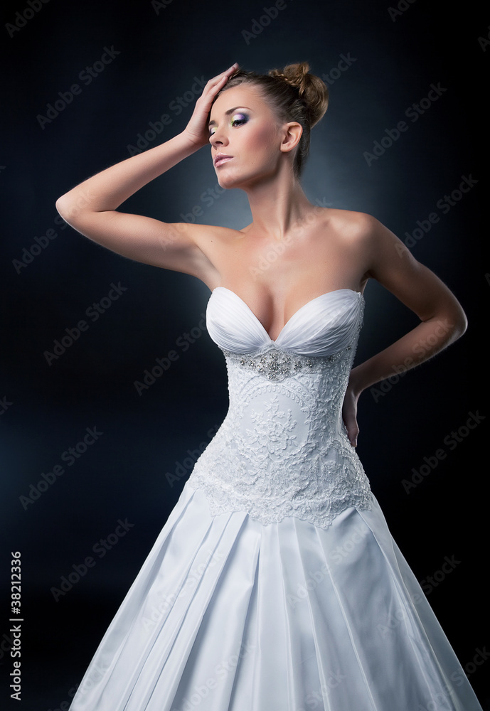 Tempting bride blonde fashion model posing in studio. Tempting bride blonde fashion model posing in studio.