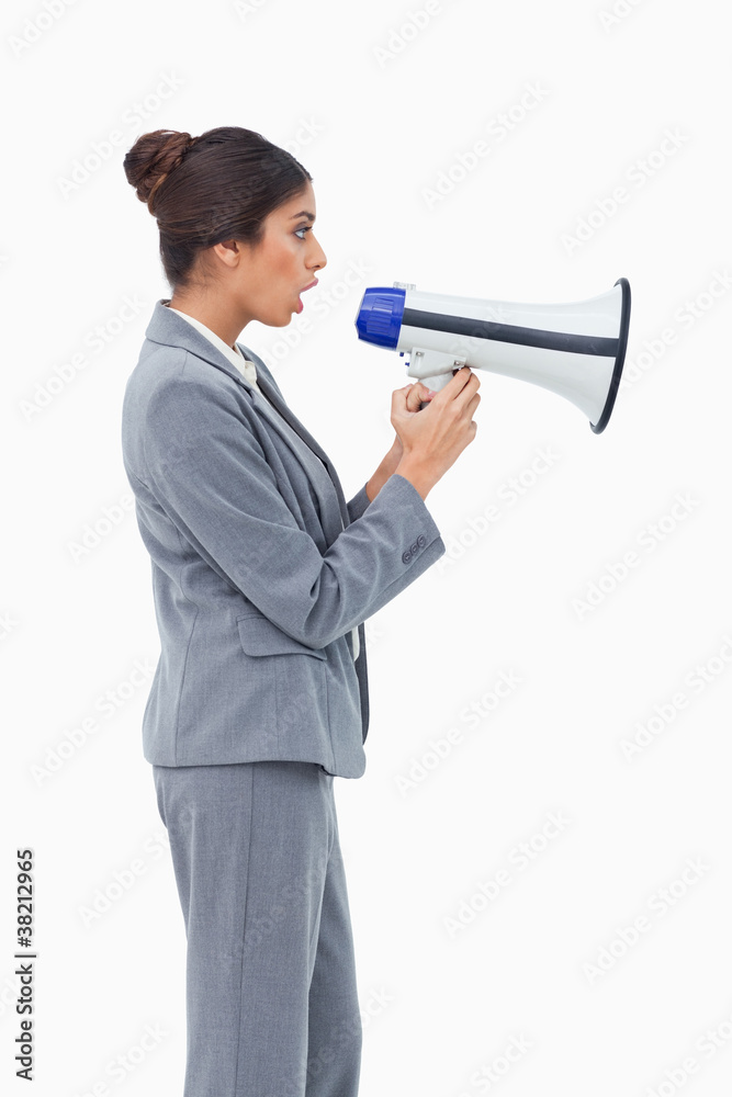 Side view of businesswoman using megaphone Side view of businesswoman using megaphone