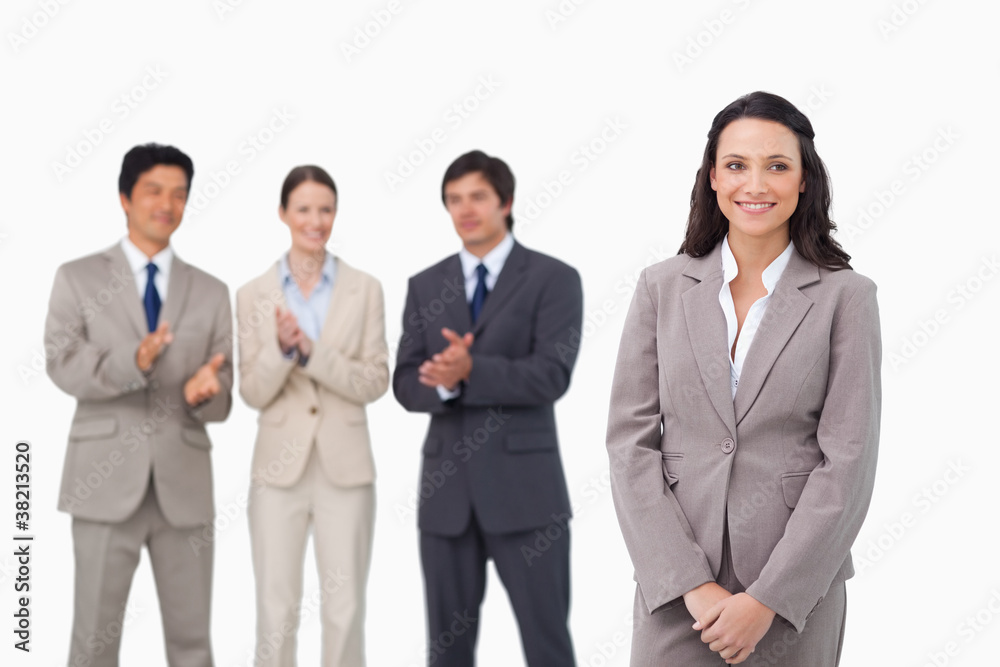 Businesswoman getting applause by colleagues Businesswoman getting applause by colleagues