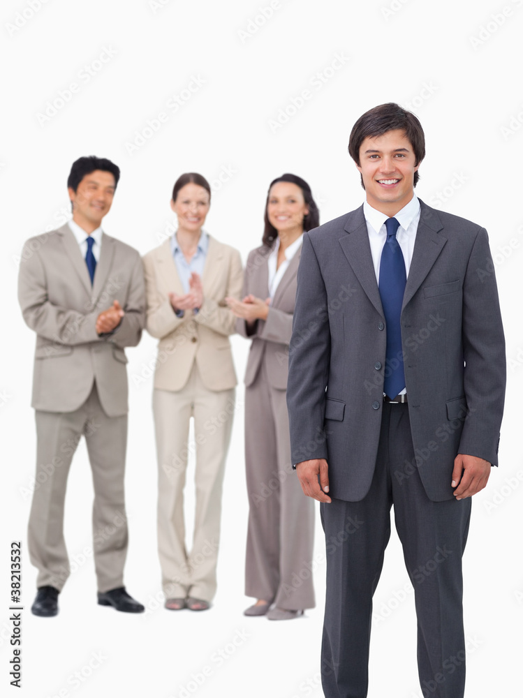 Salesman getting applause from colleagues Salesman getting applause from colleagues
