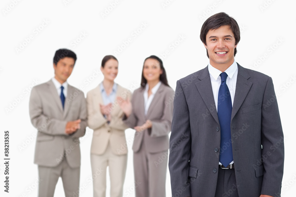 Businessman getting applause from colleagues Businessman getting applause from colleagues