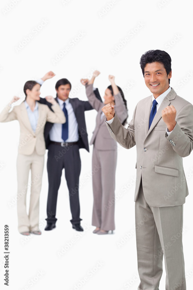 Successful businessman with cheering team Successful businessman with cheering team