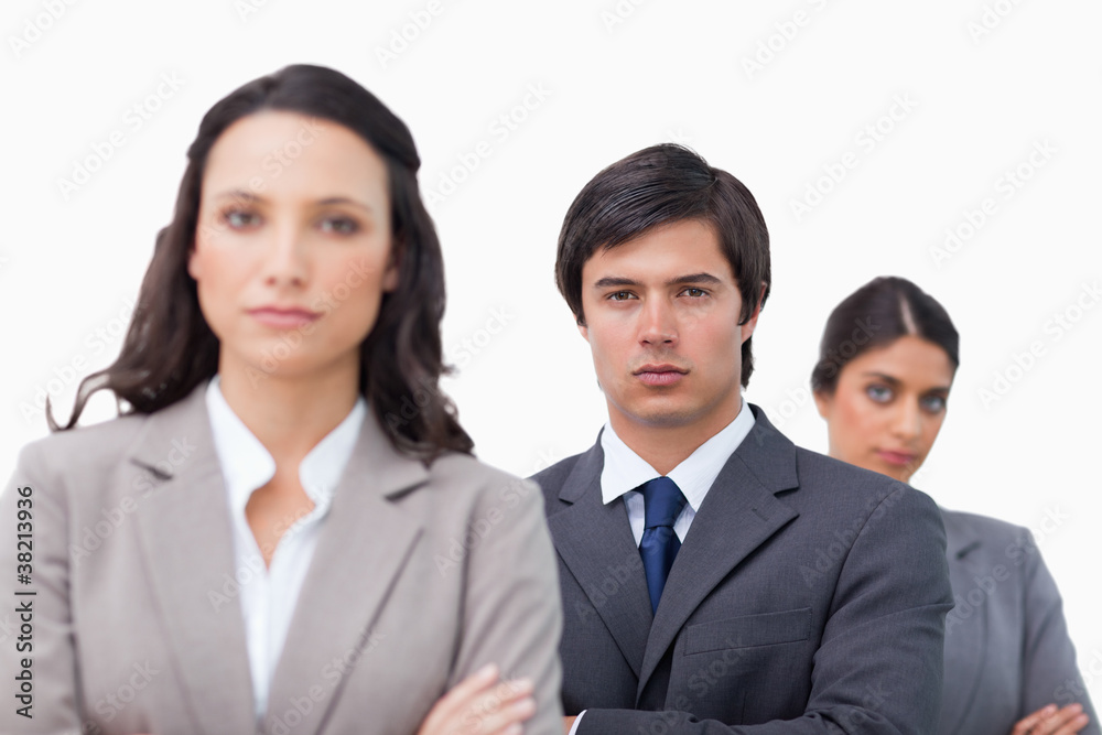 Serious businessteam with arms folded Serious businessteam with arms folded