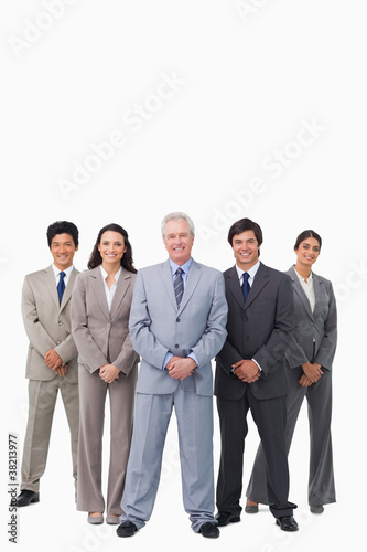 Smiling mature salesman standing together with his team