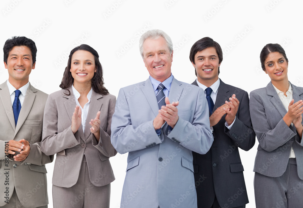 Senior businessman and his team applauding Senior businessman and his team applauding
