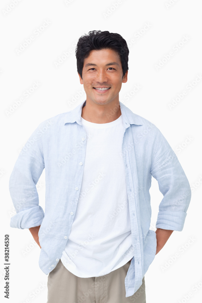 Smiling man with hands in his pockets Smiling man with hands in his pockets