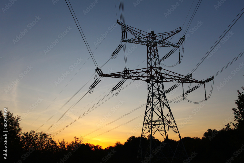 Electricity pylon at orange sunset