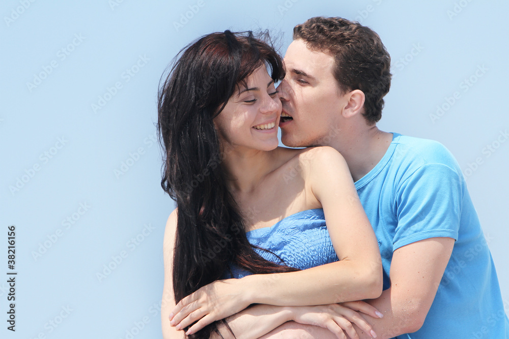 portait of young hapy couple isolated over sky background portait of young hapy couple isolated over sky background