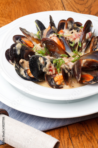bowl with cooked mussels