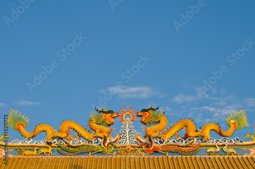 Chinese style dragons on temple's roof.