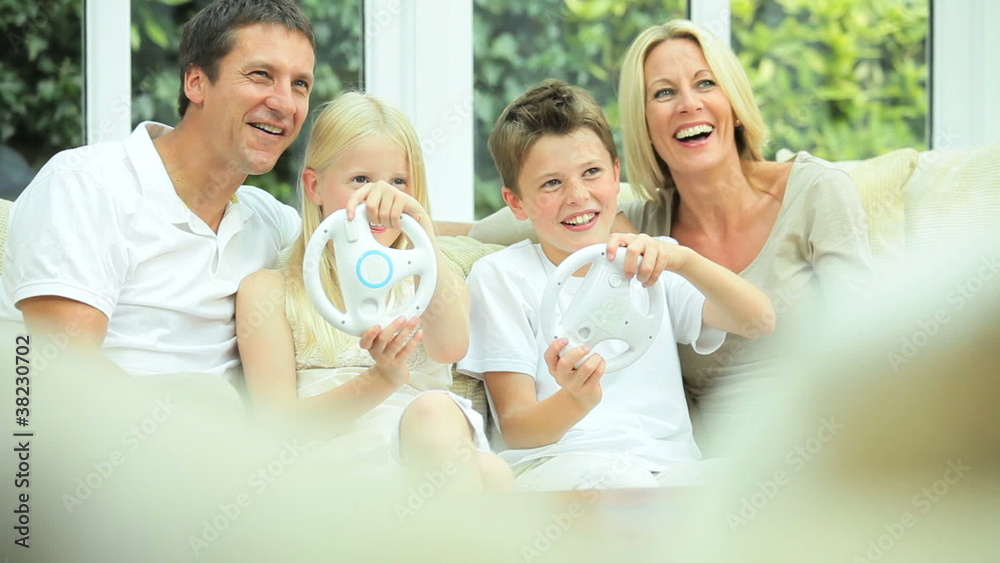 Young Children Having Fun with Electronic Game Console Young Children Having Fun with Electronic Game Console