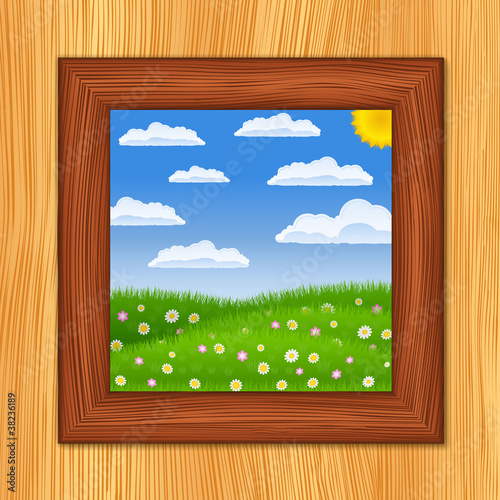 Wooden window and summer green field