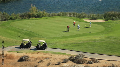 golfers on green