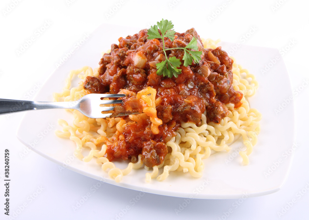 Fusilli bucati lunghi with bolognese sauce being eaten