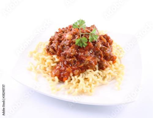 Fusilli bucati lunghi with bolognese sauce on a plate