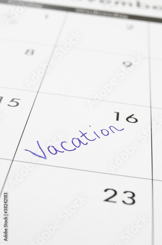 closeup of a calendar with Vacation text