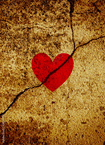 Red valentine heart on cracked grunge background