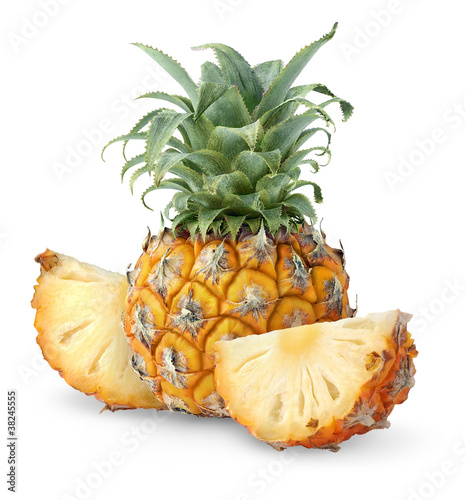 Whole pineapple fruit and two chunks isolated on white background