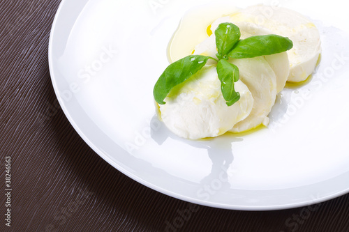 Mozzarella cheese with basil and olive oil