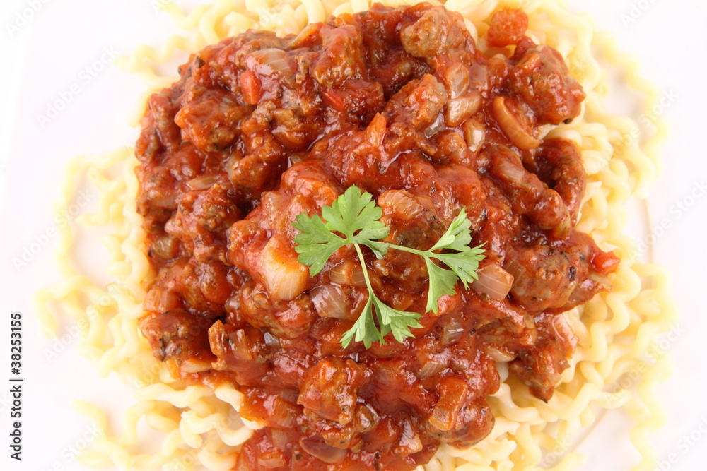 Fusilli bucati lunghi with bolognese sauce on a plate
