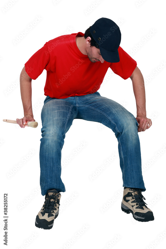 Tradesman sitting on an invisible object Tradesman sitting on an invisible object