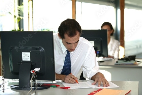 Office worker reviewing a file