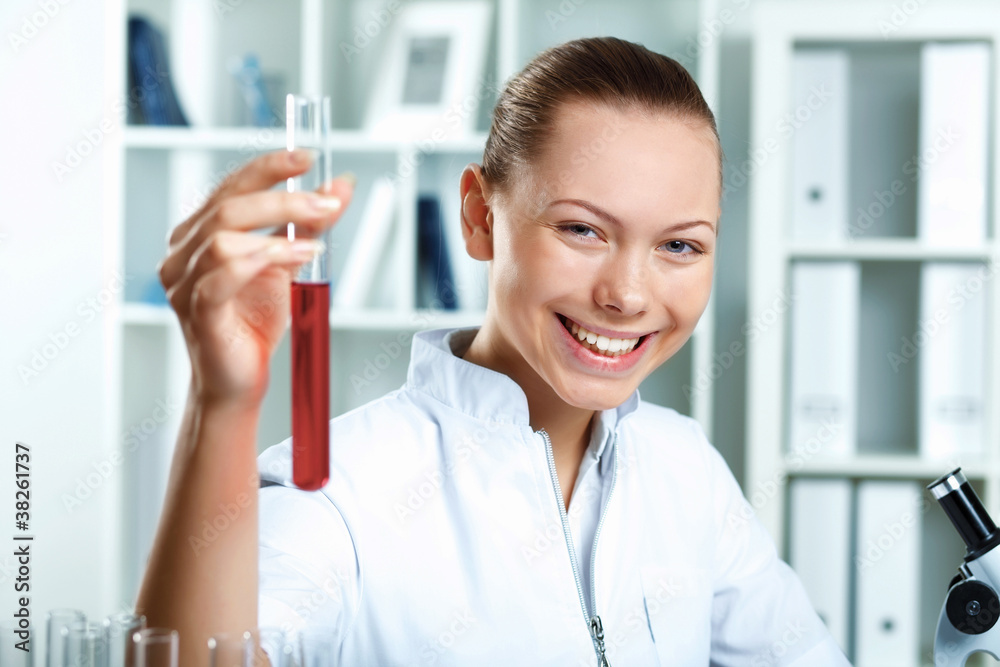 Young scientist working in laboratory Young scientist working in laboratory