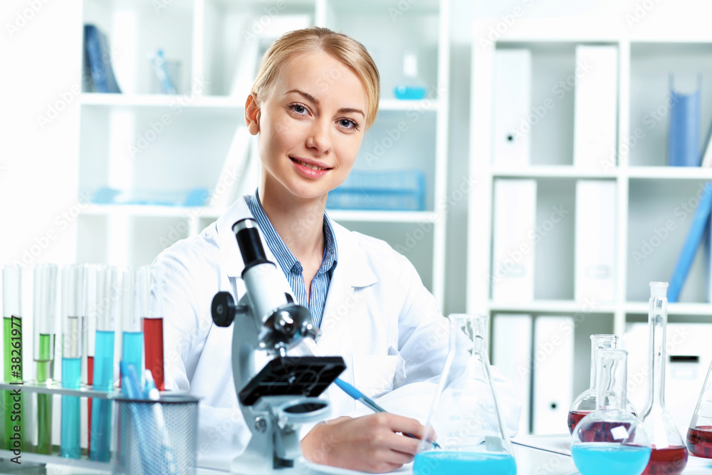 Young scientist working in laboratory Young scientist working in laboratory