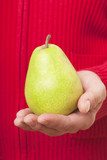 Pear in hand.