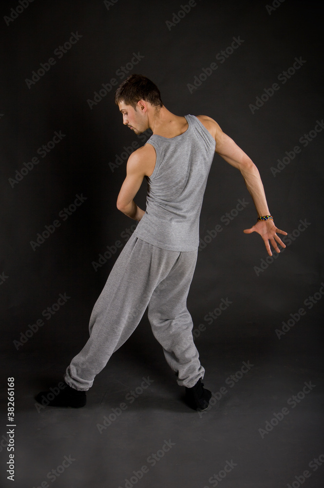cute stylish dancer in the dance sweatsuit shows