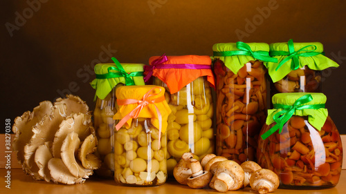 delicious marinated mushrooms in the glass jars, raw