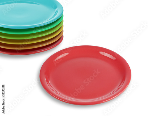 stack of colorful plates with empty red one
