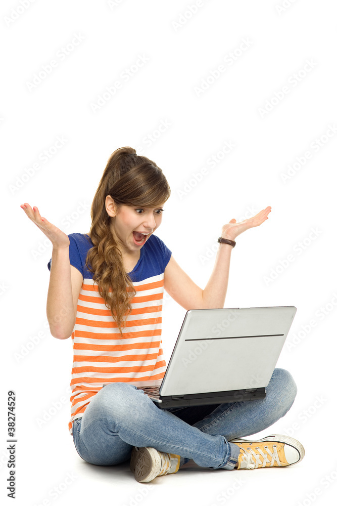 Surprised woman using laptop Surprised woman using laptop