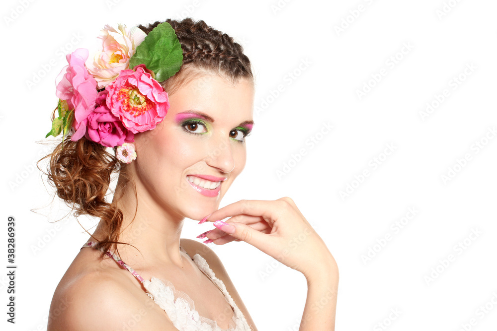 Beautiful girl with flowers in her hair isolated on white