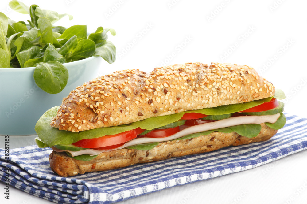 Footlong ham & swiss submarine sandwich on white background Footlong ham & swiss submarine sandwich on white background