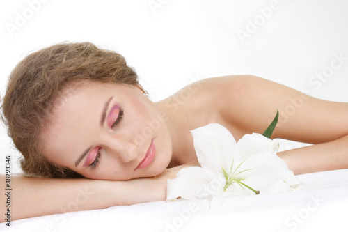 young beautiful woman relaxing over white