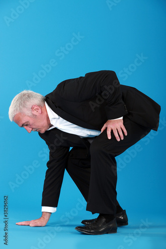 Man touching the floor