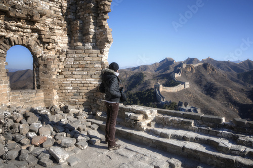 Beautiful girl standing on the Great Wall of China - Simatai