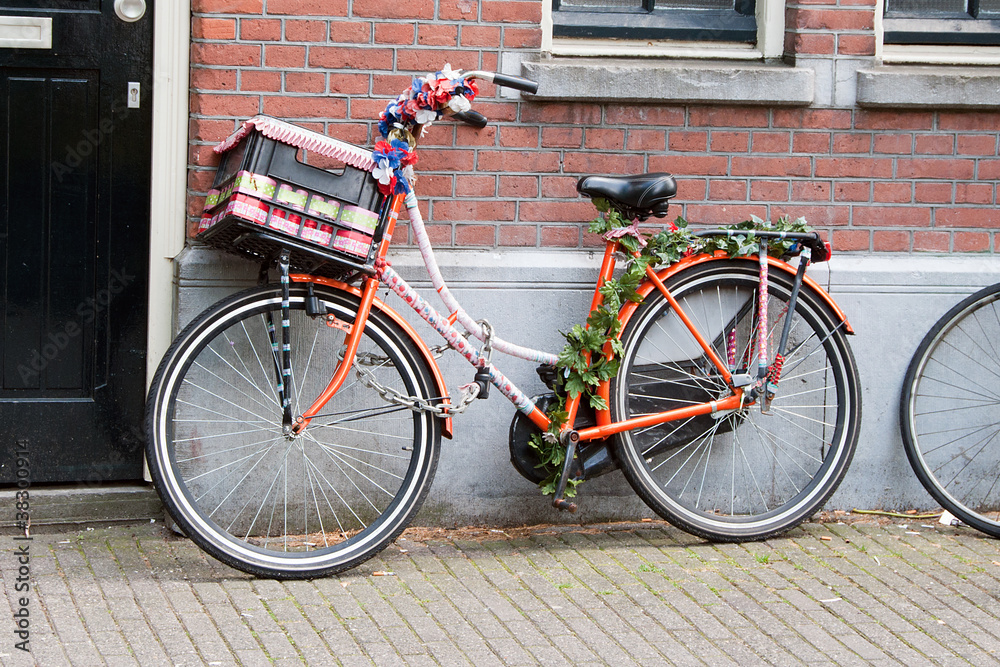 Painted bicycle, decorated with artificial flowers